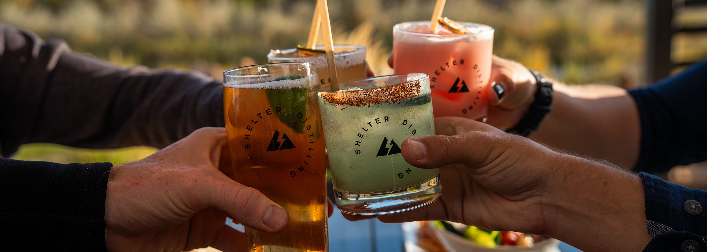 Toasting with craft cocktails and draft beer along the Uncompahgre River in Montrose Colorado 