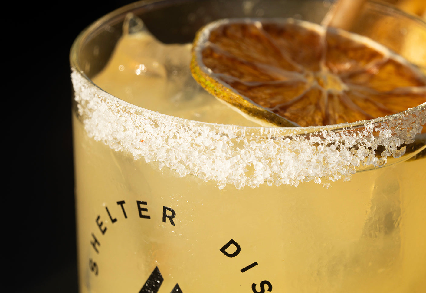 Specialty Cocktail with sugared rim and dried orange garnish. Shelter Distilling in Montrose, CO. 